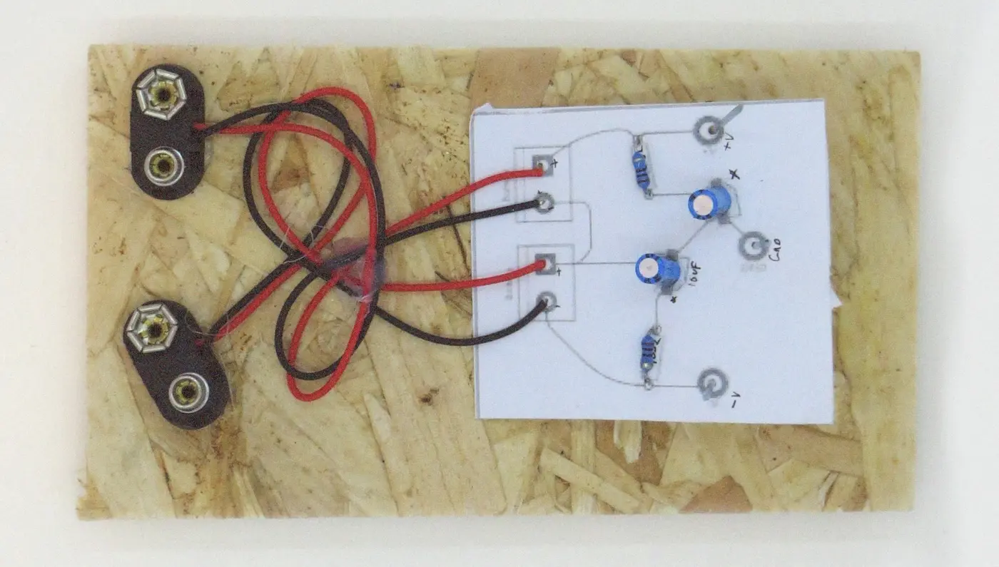 Since this power supply will be used a lot, I made it a bit more permanent by glueing it to a piece of wood.